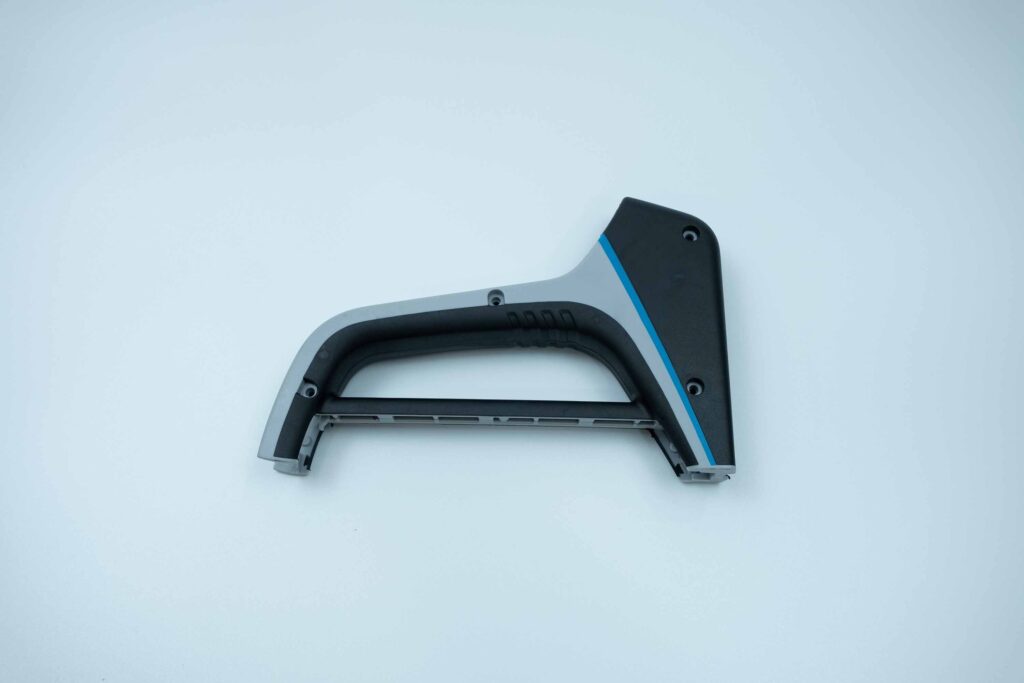 Three-color overmolded handle